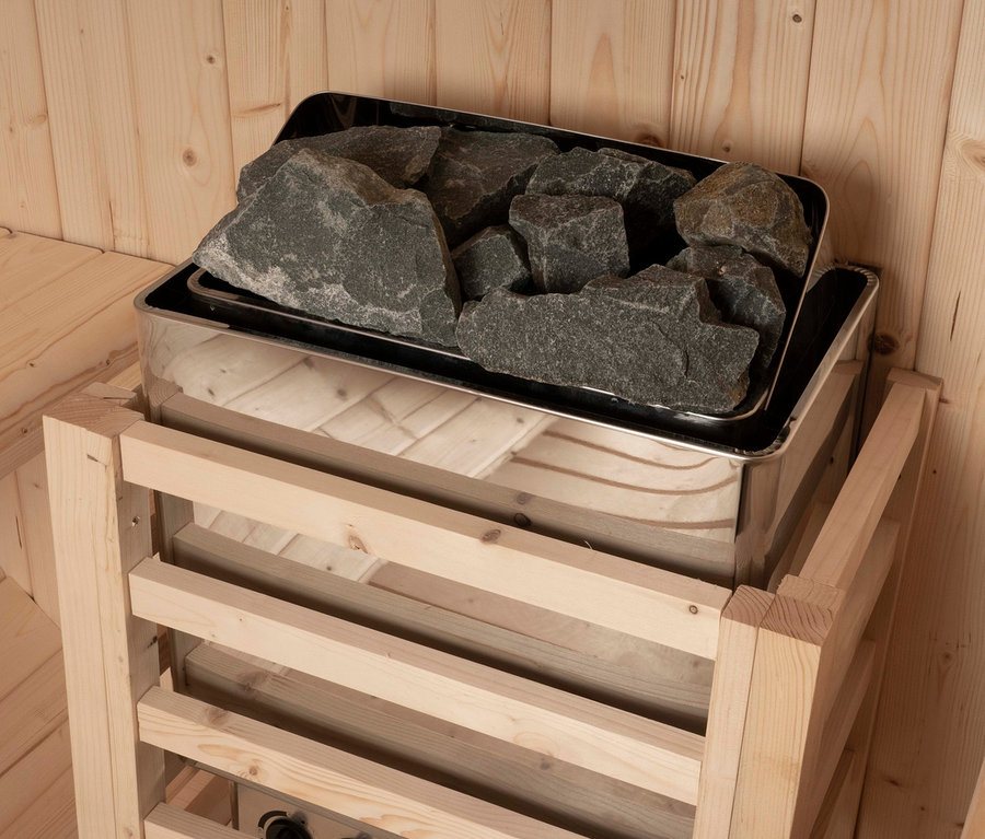 Innenraum einer Sauna mit Home-Deluxe-Outdoor-Fasssauna »LAHTI L« Ofen.