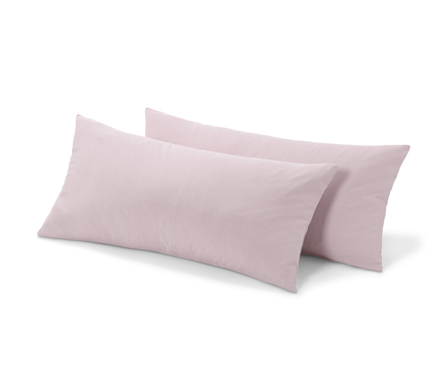 Zwei roséfarbene Jersey-Kopfkissenbezüge.