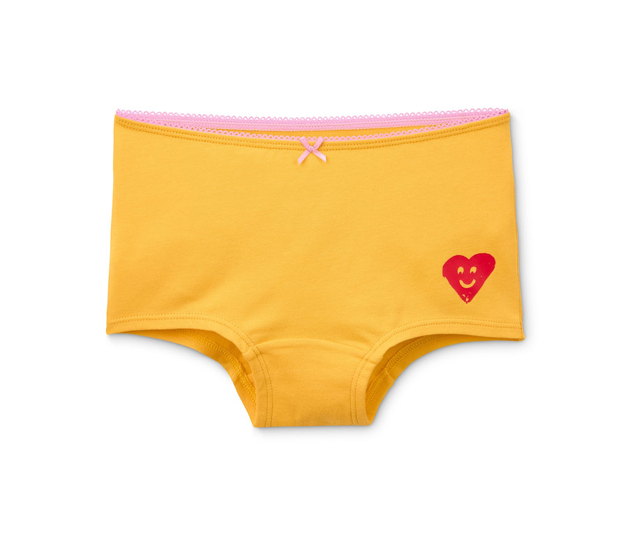 Gelbe 7 Mädchen Pantys aus Bio-Baumwolle mit rotem Herz und Schleife.