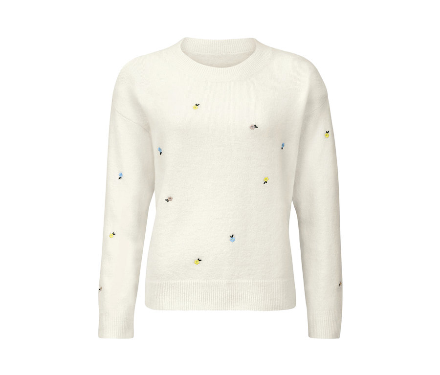 Ein bestickter, weißer Strickpullover.