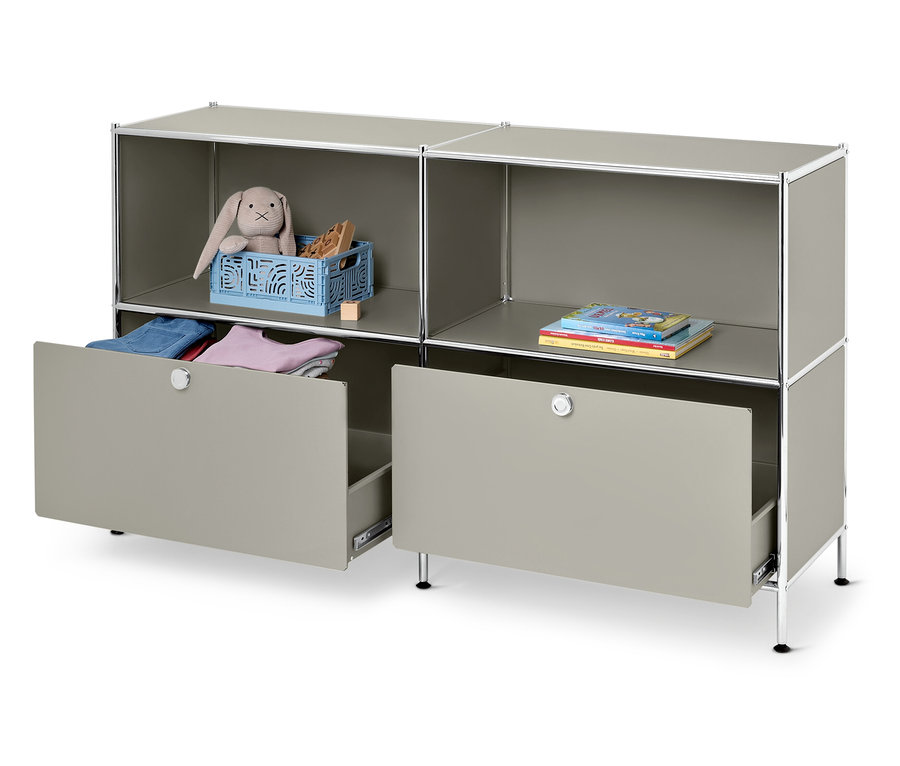 Graues modulares Regal mit Spielzeug und Büchern, eine Schublade ist offen.