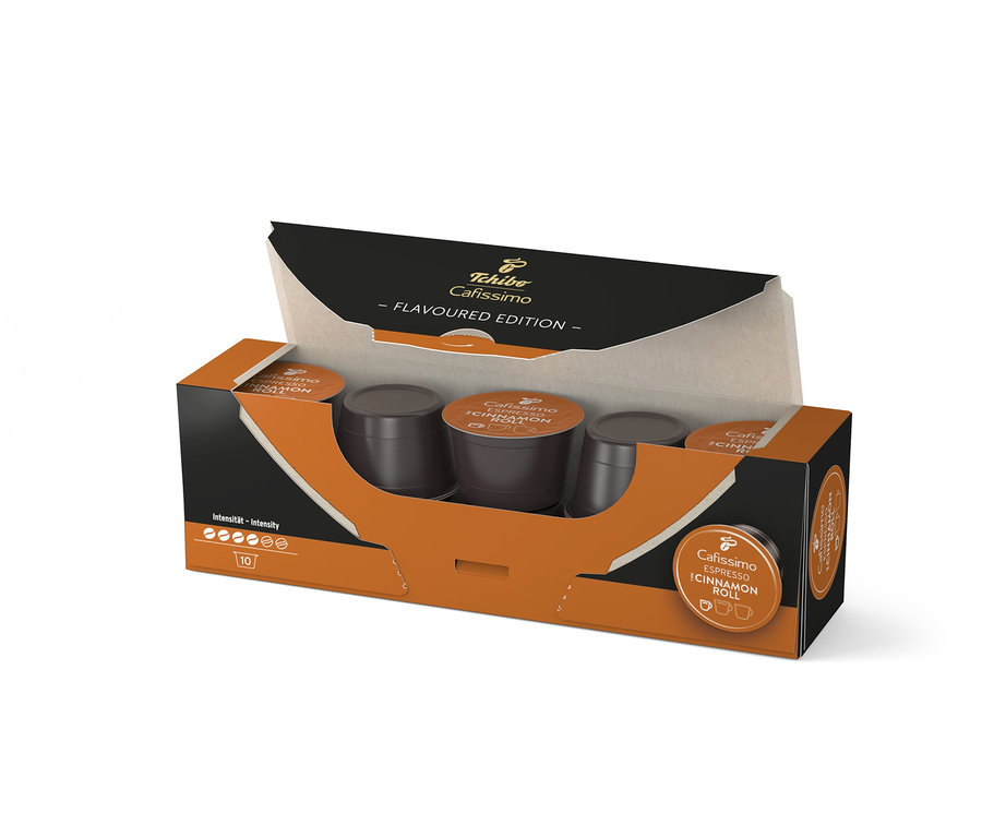 Geöffnete Packung Cafissimo Flavoured Espresso Cinamon Roll - 10 Kapseln mit braunen Kaffeekapseln.