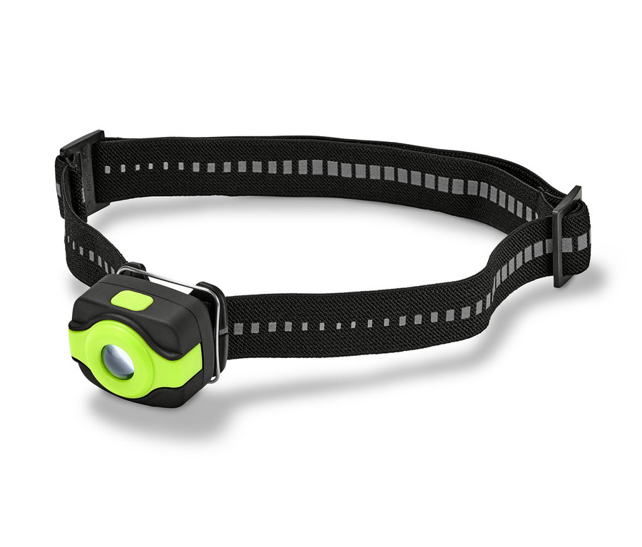 Eine kompakte Stirnlampe mit einem schwarzen Stirnband und einem grünen Rand um das Licht.