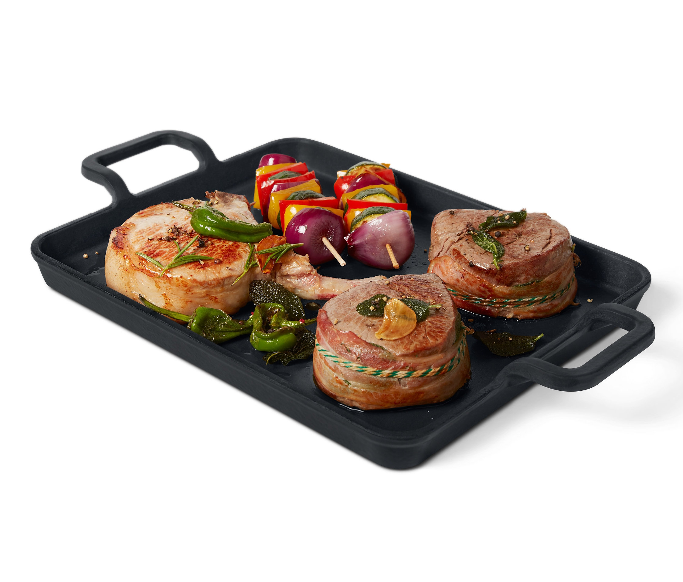 Gusseisen-Grillplatte mit Fleisch und Gemüse.