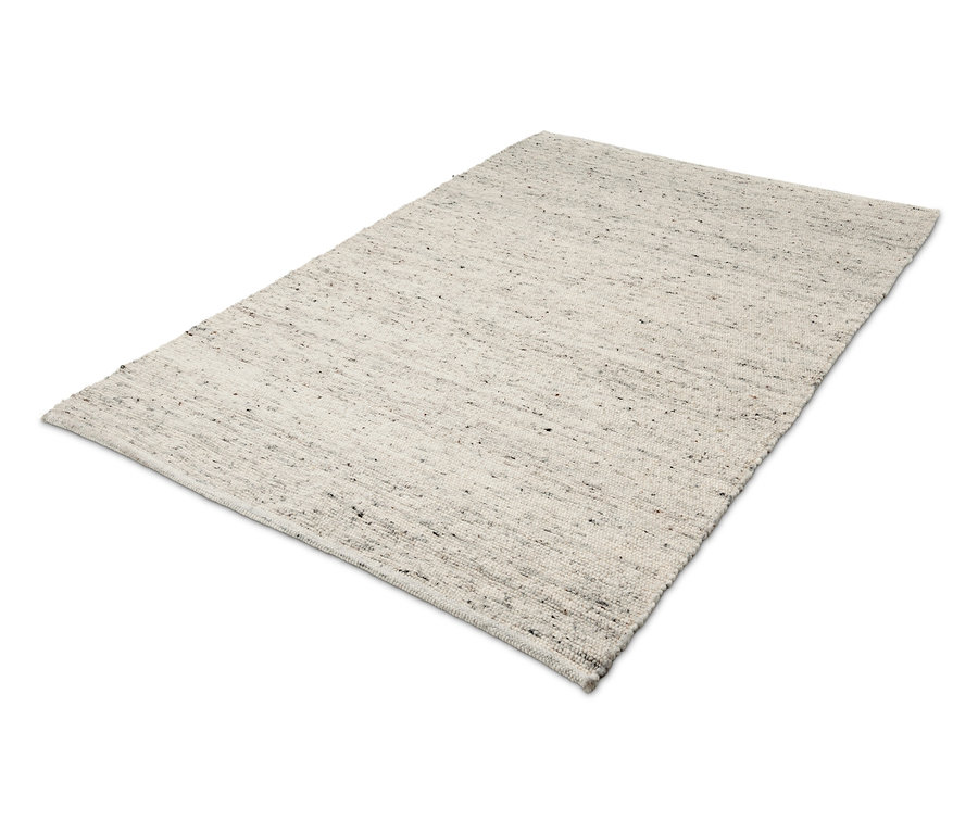 Ein Premium-Teppich, ca. 140 x 200 cm, in Beige mit einem dezenten Muster.