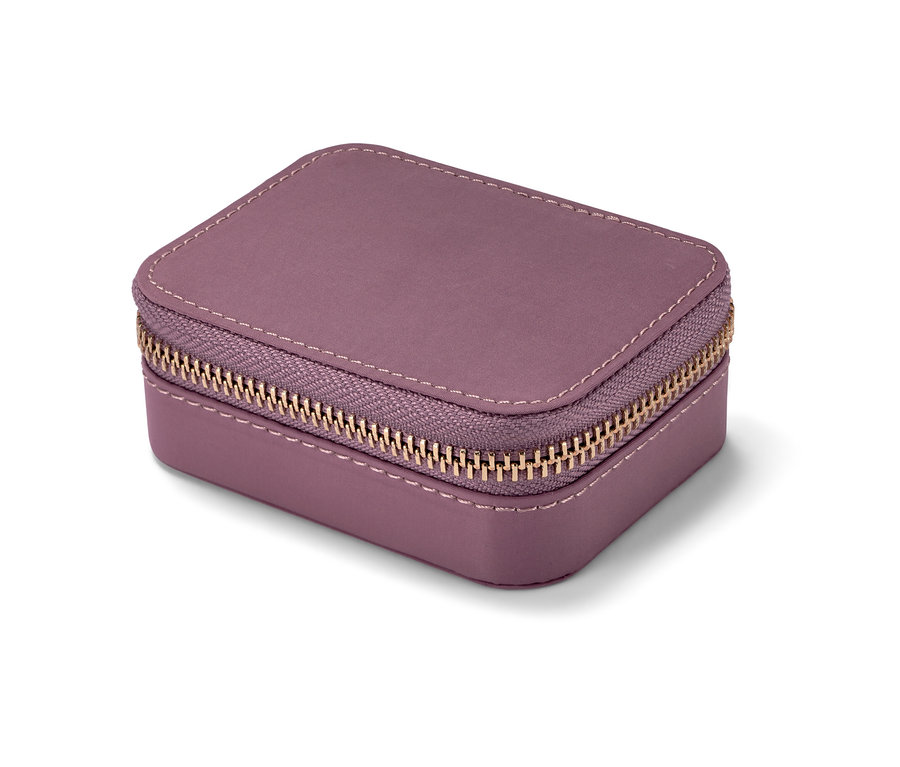 Nahaufnahme einer lila Pillendose mit goldenem Reißverschluss.