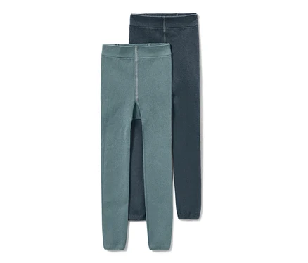 Zwei Kleinkinder-Strickleggings, eine in Petrol, die andere in Dunkelblau.