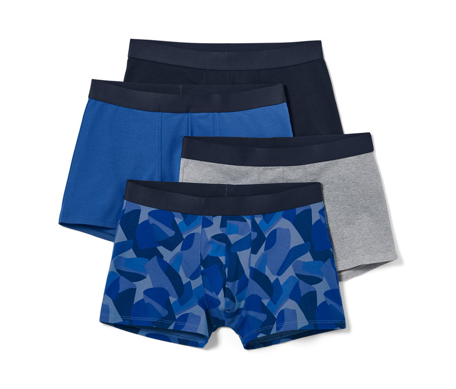 Vier Slipboxer, blau mit Alloverprint, blau, grau und dunkelblau.