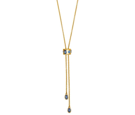 Goldene Halskette mit blauen Steinen.