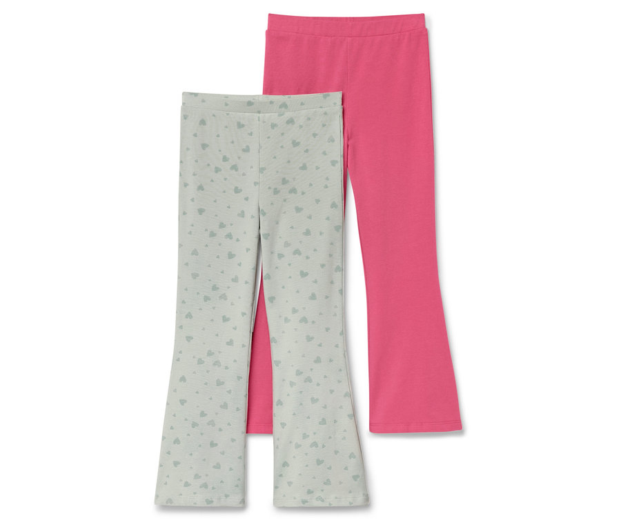 Zwei Kinderleggings: eine hellgrüne mit Herzmuster und eine pinke.