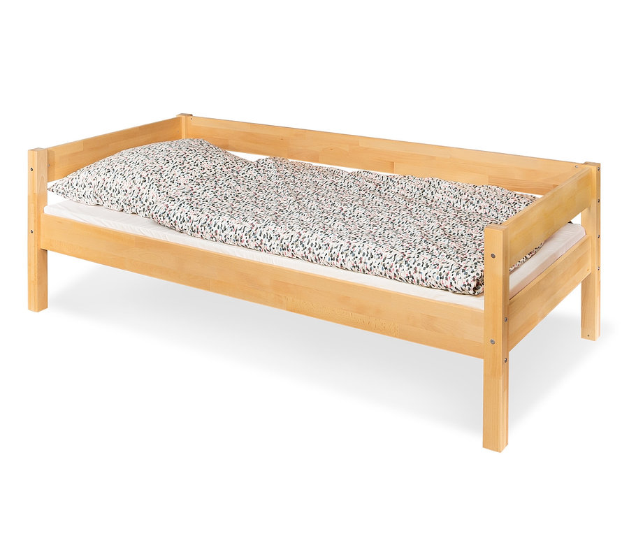 Ein Jugendbett aus Massivholz mit Blumendruck Bettwäsche.