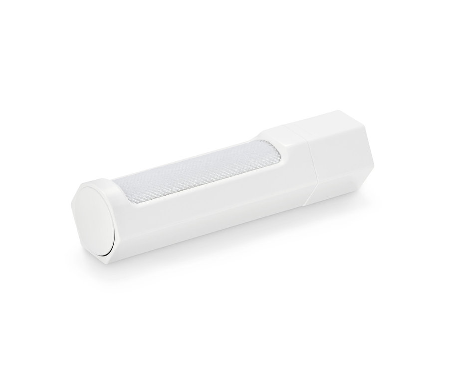 Eine weiße Kleiderbürste liegt auf einer weißen Oberfläche.