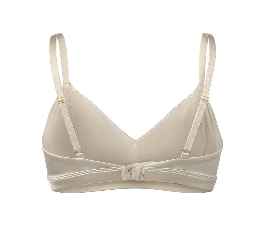 Detailansicht eines cremefarbenen Soft-BHs mit verstellbaren Trägern und Hakenverschluss.