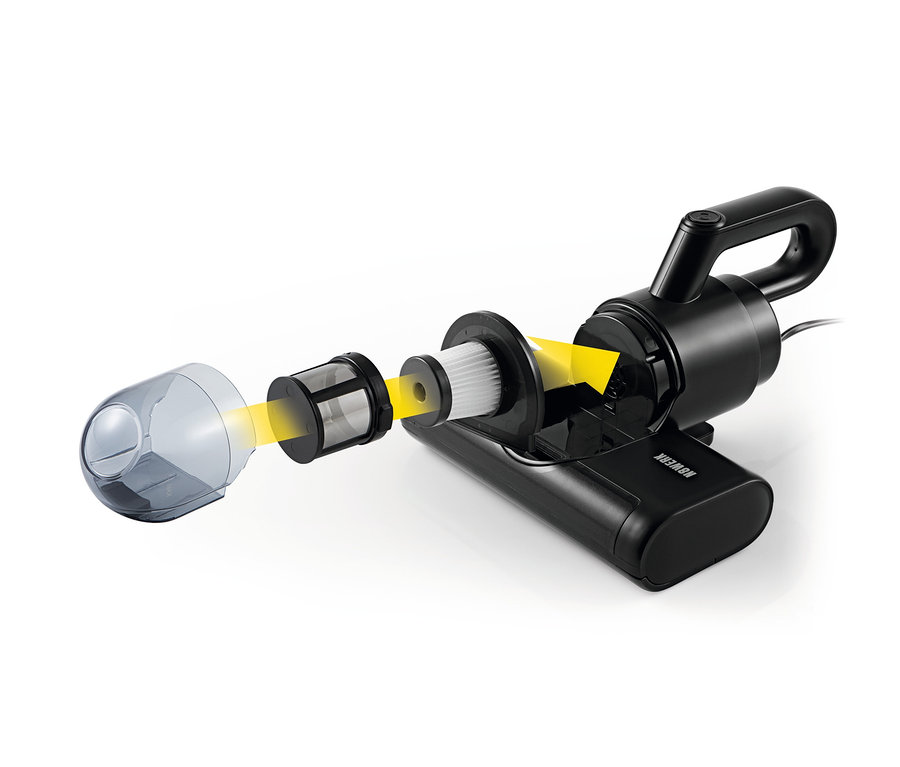 Ein zerlegter schwarzer N8WERK Milbensauger mit pulsierender Bürste und gelben Pfeilen, die den Luftstrom zeigen.