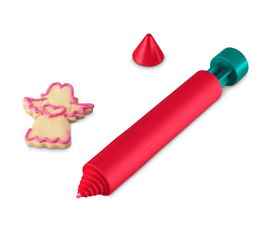 Ein roter Dekorierstift liegt neben einem Engelsplätzchen.