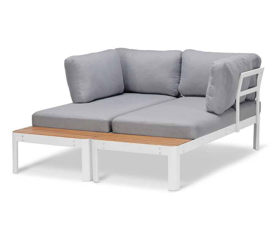 Lounge-Ecke mit höhenverstellbarem Couchtisch hat graue Kissen und ein weißes Gestell.