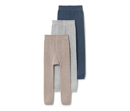 Drei Kinder-Strickleggings in Braun, Grau und Blau.