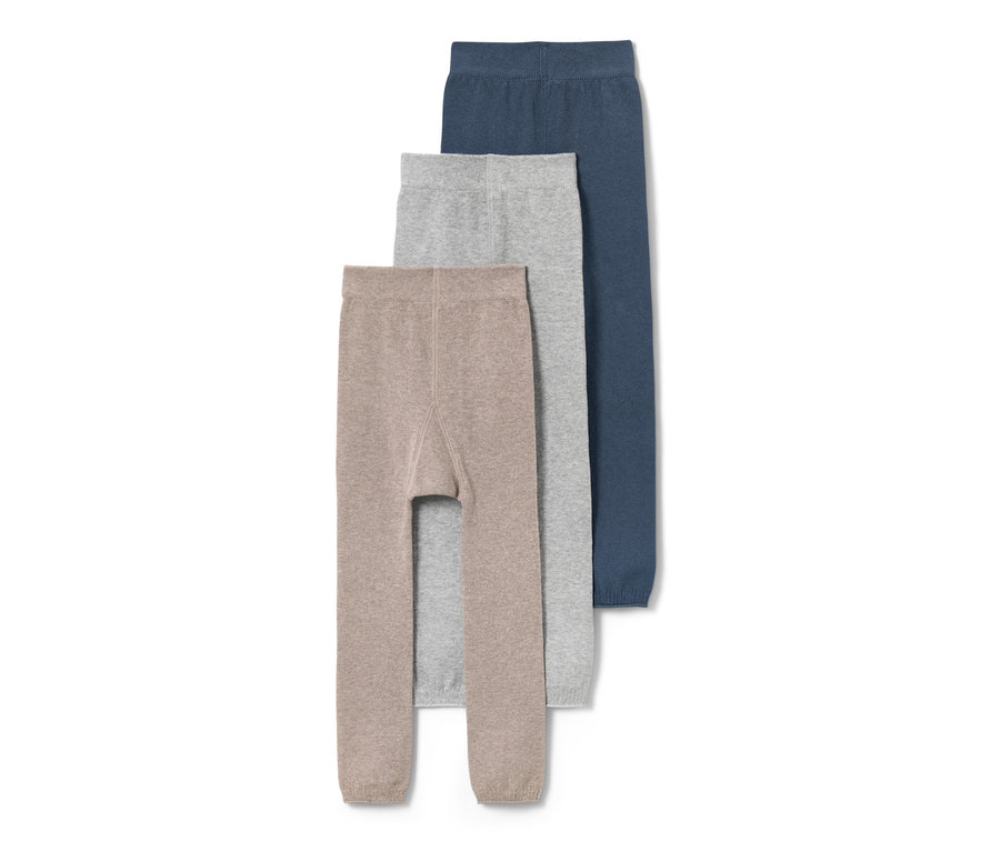 Drei Kinder-Strickleggings in Braun, Grau und Blau.