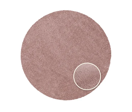 Nahaufnahme eines runden, pinken Teppichs "Charme" mit kurzem Flor.