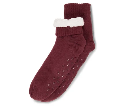 Zwei burgunderrote Socken mit rutschfester Sohle und weißem Rand.