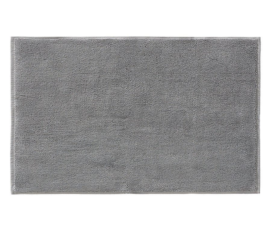 Graue Badematte mit getufteter Textur.