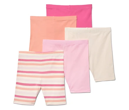 Fünf kurze Leggings in Pink, Apricot, Beige, Rosa und gestreift liegen übereinander.