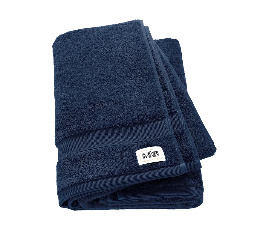 Zwei gefaltete blaue Badetücher der SCHÖNER WOHNEN-Kollektion »Cuddly« liegen übereinander.