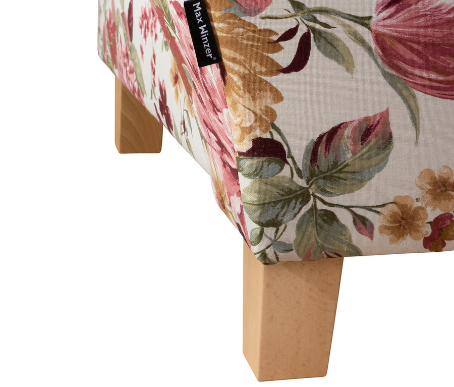 Detail einer Ecke und der Füße der floralen Recamiere »Saturn«.