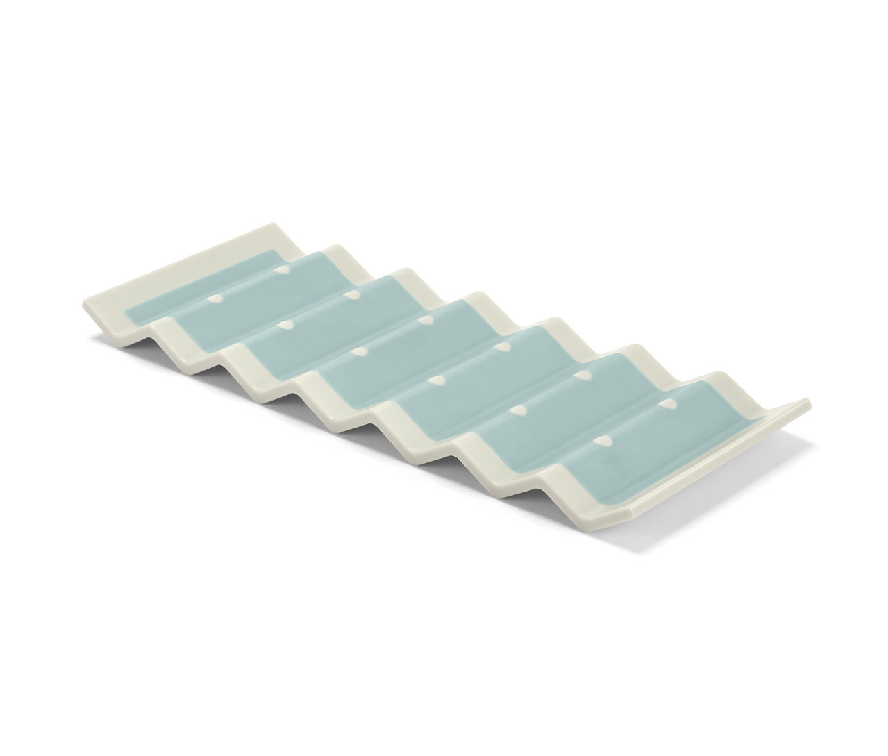 Kühlschrank-Flaschenhalter mit weißem Rand und blauen Mulden.