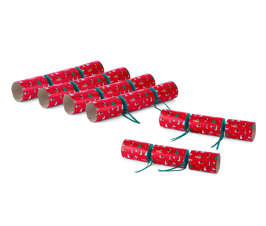 Sechs rote DIY-Überraschungsbonbons mit Weihnachtsmotiven.