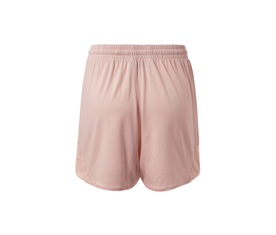 Detailansicht der rosa Shorty-Pyjama mit elastischem Bund und Spitze an der Seite.