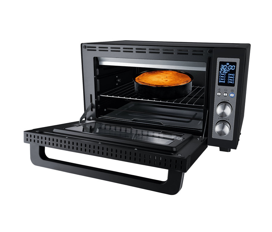 Offener schwarzer Steba Digitaler Grillbackofen »KB E300« mit Kuchen im Inneren.