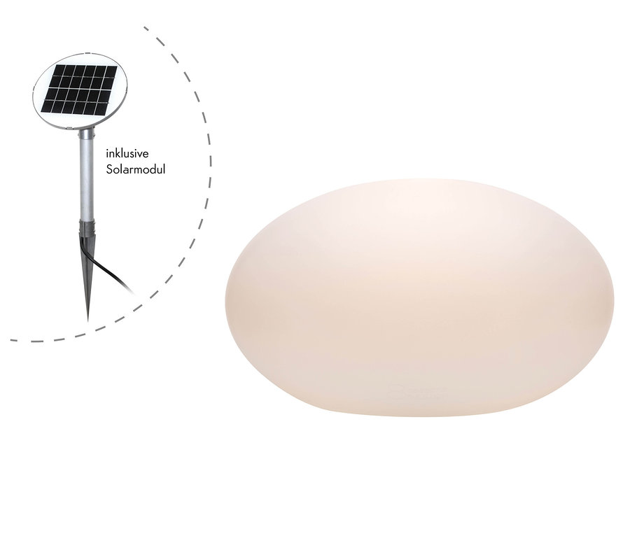 Beleuchteter, weißer Stein und Solarpanel.