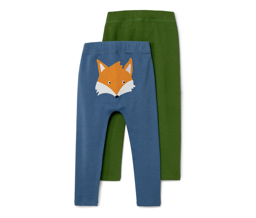 Zwei Babyhosen: eine blaue mit Fuchs-Applikation und eine grüne.