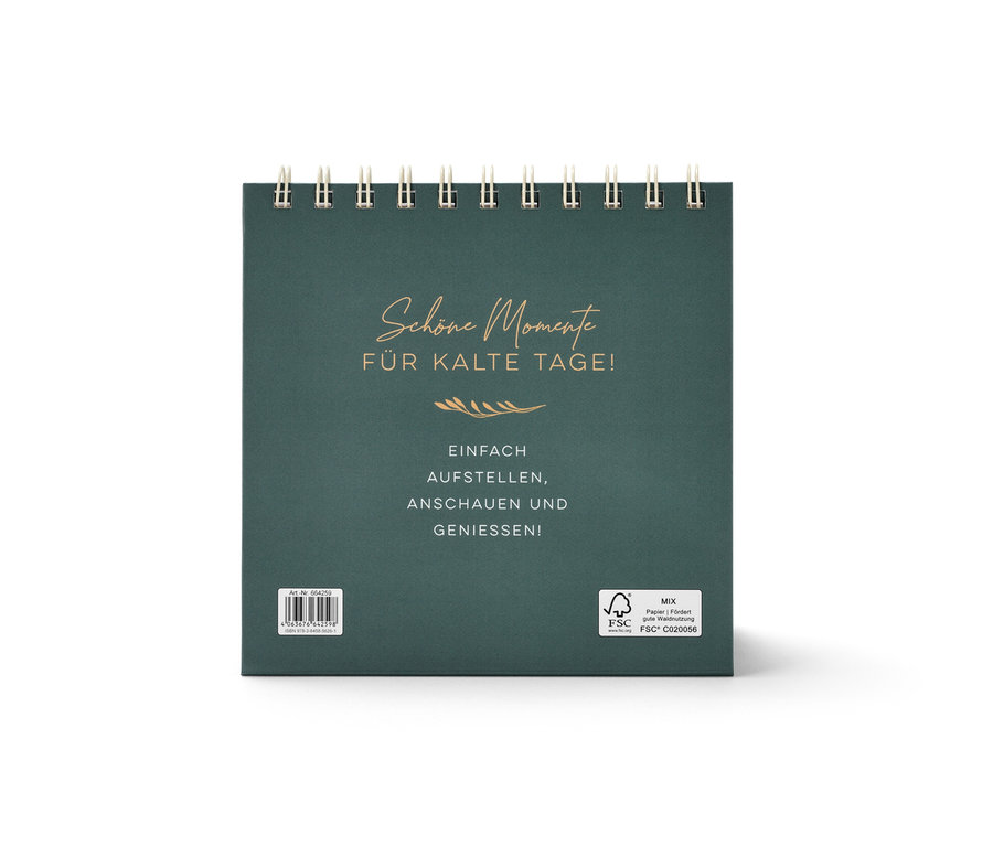 Nahaufnahme eines dunkelgrünen Buch-Tisch-Aufstellers »Mach jeden Tag magisch«.