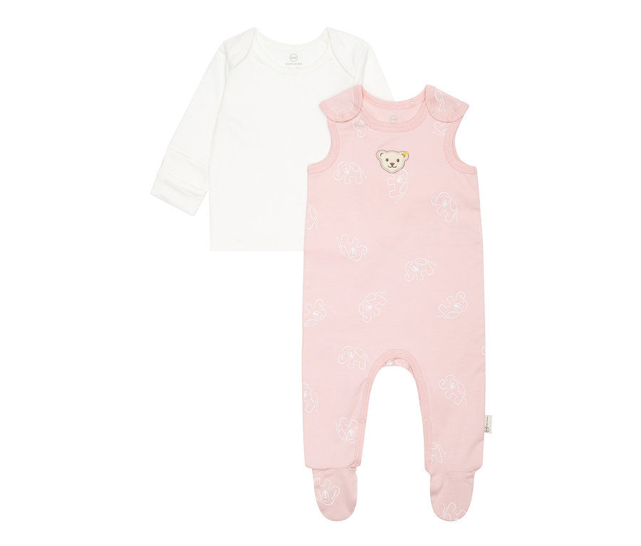 Zwei Baby-Kleidungsstücke: ein weißes Langarmshirt und ein rosa Strampler mit Elefantenmuster. Steiff, 2 Baby-Strampler, rosa
