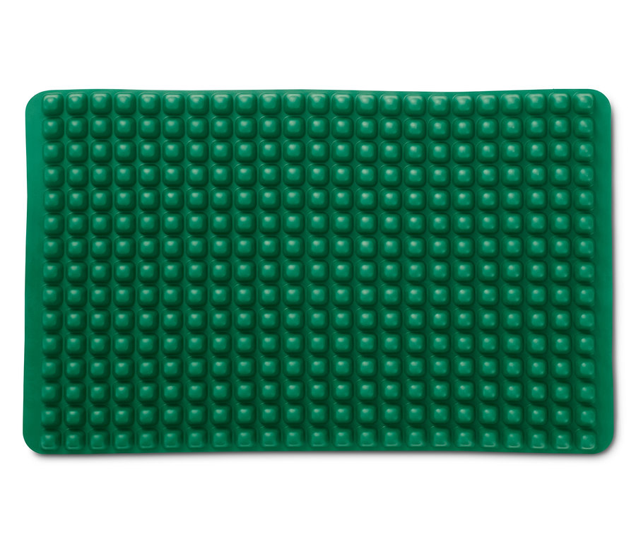 Eine grüne Dauerbackmatte mit kleinen Noppen.