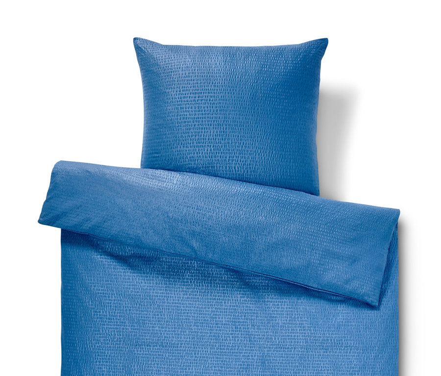 Blaue Seersucker-Bettwäsche Normalgröße mit Kissen.