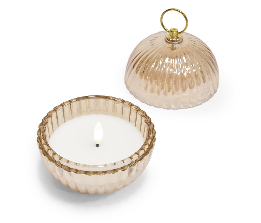 Dekorative Kerze in einem Glasbehälter mit Deckel.