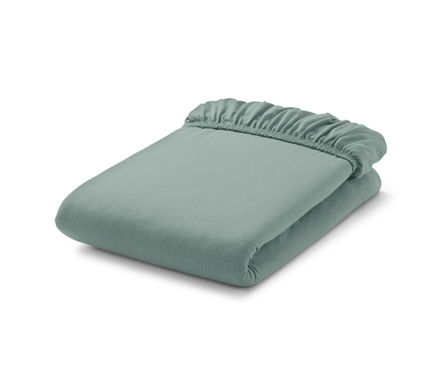 Ein mintgrünes Jersey-Spannbettlaken in Doppelgröße, gefaltet.