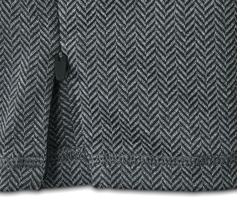 Detailaufnahme einer Sporttights mit Fischgrätenmuster und Reißverschluss.