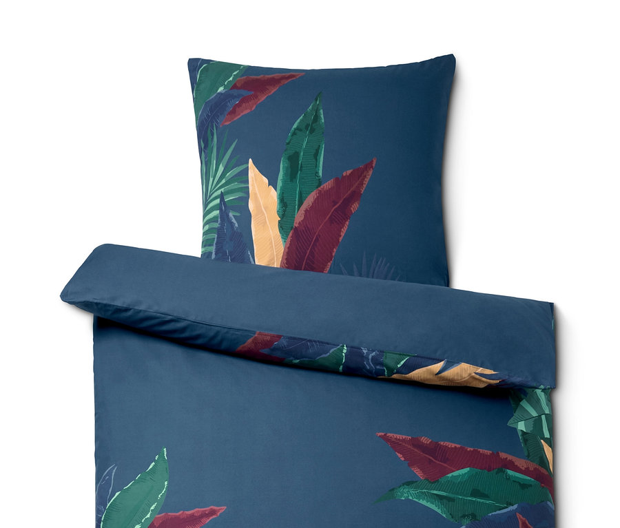 Blaues Perkal-Bettwäsche-Set mit tropischem Blättermotiv, inklusive Kissen- und Deckenbezug.