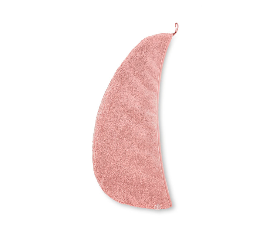 Rosafarbenes Turban-Handtuch auf weißem Hintergrund.