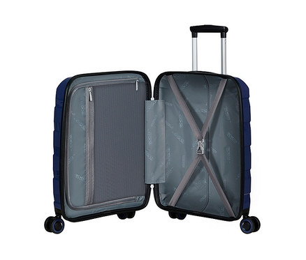 Geöffneter, kleiner, dunkelblauer American Tourister »Air Move« Spinner mit ausziehbarem Griff und vier Rädern.