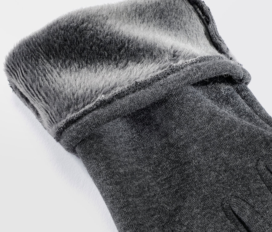 Detailaufnahme eines grauen Sweathandschuhs mit grauem Kunstfellfutter.