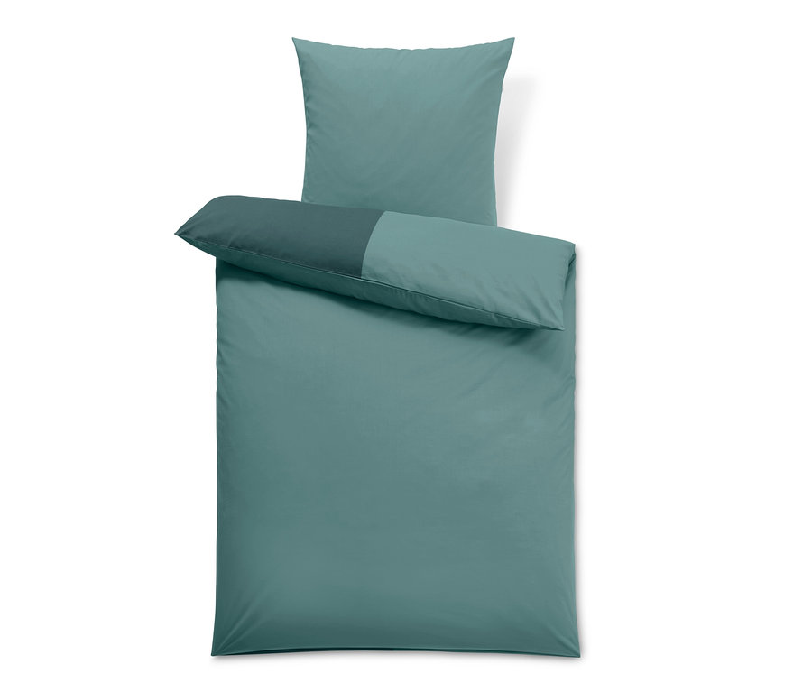 Blaues Baumwollbettwäsche-Set mit Kissen oben.