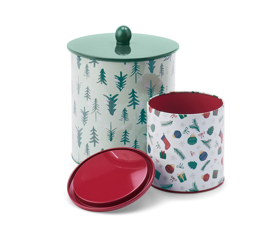Zwei Keksdosen mit weihnachtlichen Motiven.