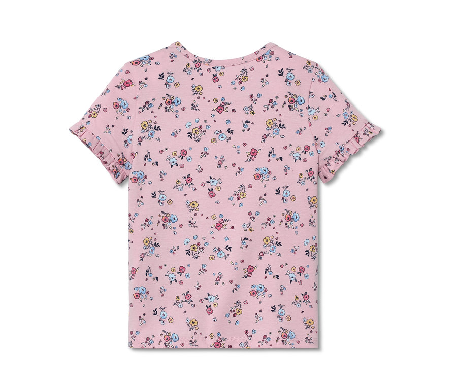 Rosa Kinder-T-Shirt mit Blumenmuster und kurzen Ärmeln. Das T-Shirt hat Rüschen an den Ärmeln. 2 Kinder-T-Shirts mit Applikation.