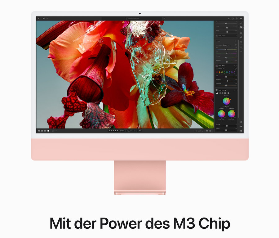 Nahaufnahme eines rosa Apple iMac 24" mit Blumen-Hintergrund.