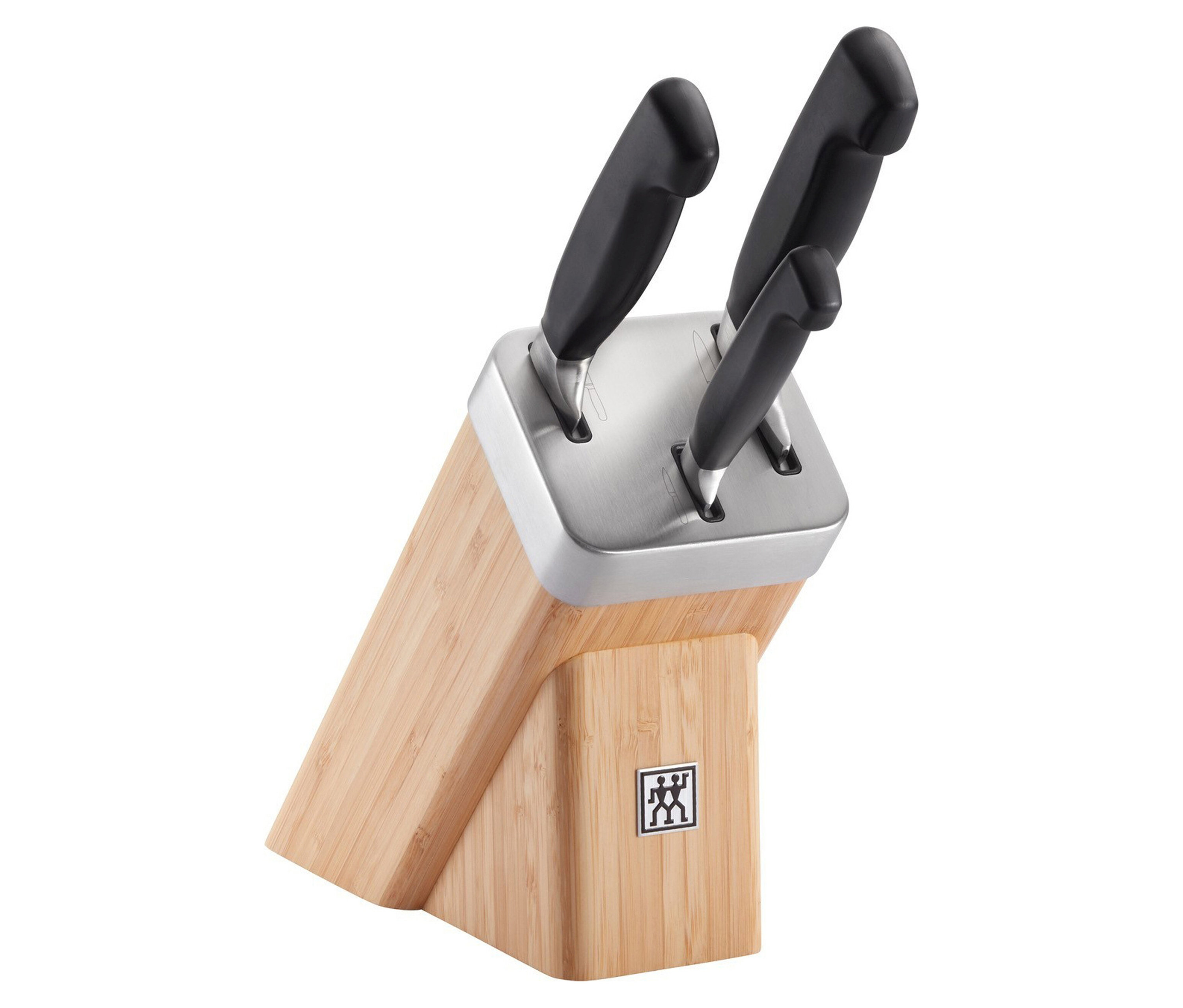 Messerblock aus Holz mit Edelstahl-Oberteil und drei Messern mit schwarzen Griffen.